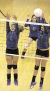 A pair of Palmer players leap for the block during a 3-1 win
over the Colony Knights at Colony High School. (JEREMIAH
BARTZ/Frontiersman)