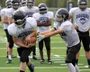 Redington players work on an offensive drill during a practice earlier this month. The Huskies showed progress on the offensive side of the ball, Aug. 27, scoring 30 points against Valdez. Je