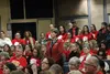 Mat-Su Education Association president Dianne Shibe stands among a crowd people wearing red in support of Mat-Su School District teachers and staff during the Mat-Su School Board meeting Wedn