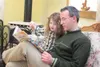Dr. Steve E. Parker and daughter Tirzah, 6, read a book in the
waiting room of the family's new Coho Family Medicine clinic, which
is set to open Wednesday. The clinic is located off the Trun