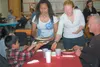 Glacier View high school students — sophomore Holly Stock and senior Tiffany Gerwig — serve dinner to community members at an Italian dinner fundraiser. Courtesy photo