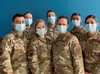 Air Force Reserve medical professionals from the 302nd Airlift Wing, Peterson Space Force Base, Colo., pose for a picture prior to mobilization for COVID-19 support. The Air Force Reserve is 