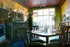 “Fat Olives” is one of many Jeanne Young paintings that capture
poignant moments of life. Details like lighting and the color
palette set a striking mood.
