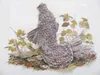 This work of paper art by Jacki Cabo depicts a grouse in a
natural woodlands setting. (Courtesy photo)