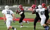 Houston junior quarterback Robert Ritter rolls out to find a passing lane during a 34-0 win over Eagle River Friday, Aug. 19, 2016, at Houston High School. Ritter scored on a pair of short ru
