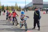Bike rodeo participants ride an obstacle course in the Menard Center parking lot May 13. JACOB MANN/Frontiersman