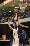 Palmer senior Michael Kluting lifts the ball to the basket during a 55-42 loss to the Lynx in the quarterfinal round of the ASAA/First National Bank 4A State Basketball Championships March 24