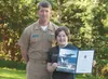 Teresa Kennedy, a 2011 Wasilla High School graduate, stands with LCDR Jay DuHadway USNR (retired), U.S. Naval Academy Department of Admissions deputy area coordinator for Alaska. Kennedy has 