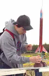 Tyler Chandler positions his rocket for takeoff Wednesday
morning. The Wasilla High School freshman class took part in Rocket
Day.CASEY RESSLER/Frontiersman