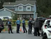 Alaska State Troopers stand near the scene of an officer-involved shooting about in Wasilla Thursday, June 2, 2016. Troopers say a man attacked multiple troopers at the scene with a knife, an