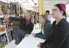 Gorilla Fireworks employee Kim Wailes explains the different
kinds of fireworks to customers Ashley Carson and Alaina Jaggli
Saturday afternoon. It is illegal to shoot off fireworks within in