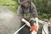 Frontiersman file photo A fishing guide fillets silver salmon
for a client at the cleaning station near the Little-Susitna boat
launch. While engaged in the act of guiding clients, a sportfis