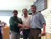 Randy Bovy and Mat-Su Miner general manager Pete Christopher
congratulate Paul Whitmore, of Palmer, after Whitmore won a $1,000
prize during the annual Mat-Su Miner Grand Raffle at the Moose
