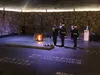 Secretary of Defense Lloyd J. Austin III stands at attention as two U.S. Marines salute after Austin placed a wreath at Yad Vashem in Jerusalem, April 12, 2021. Also called the World Holocaus