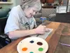 A Maple Springs resident works on an art project. Courtesy photo.