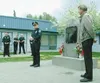 At a ceremony Saturday during Colony Days, Palmer City Manager Tom Healy, right, and Palmer Police Chief George Boatright describe the intent of a new memorial in front of the Palmer Police D