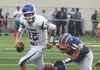 Palmer quarterback Clayton Southwick tries to scramble away from the pressure of a Bartlett rusher during a loss to the Golden Bears Aug. 19, 2016, at Bartlett High School in Anchorage. MATT 