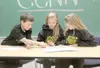 Cottonwood Elementary fifth-graders, from left, Cooper Smith,
Lily Sessom and Amanda Mayer work on the script for the school’s
daily newscast. (GREG JOHNSON/Frontiersman)