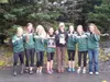 The Colony Knights girls cross country-running team and head coach Rhonda Knopp pose for pictures after Colony captured the Region III girls team title Sept. 27 in Kodiak. Knopp was also name