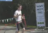 HEATHER A. RESZ/Frontiersman Daniel Novakovich, 17, crosses the
finish line in 14th place with a time of 1:06:32.1 in the second
annual Why Not Tri? Wasilla Triathlon on Aug. 6.