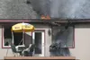 Flames work their way along the roof edge of a single-story fire
on E. Boulder Drive Sunday afternoon. (ROBERT
DeBERRY/Frontiersman)