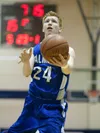 Palmer's Brian Selmer shoots for two points during semi final competition at the 2013 Northern Lights Region III Basketball Tournament in Soldotna. ROBERT DeBERRY/Frontiersman.com