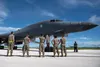 Airmen assigned to the 28th Bomb Wing recieve a U.S. Air Force B-1B Lancer assigned to the 37th Expeditionary Bomb Squadron, Ellsworth Air Force Base, South Dakota, after landing at Andersen 