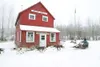 ROBERT DeBERRY/Frontiersman Ryan Redington passes in front of
the old Knik City Hall Building at the historic Knik townsite
during the start of the Knik 200 Joe Redington Sr. Memorial Sled
Do