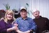 Arthur Jennings, center, poses for a photo with Mat-Su Regional Hospice volunteers Sandra Falkner and Paul Supina after a March 2015 interview at Jennings' Wasilla home. Jennings' book of mem