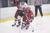 ROBERT DeBERRY/Frontiersman Wasilla senior forward Brianne Bohn
scrambles after the puck Friday against the Lathrop Malemutes at
the 2011 First National Cup State Hockey Championships at the
