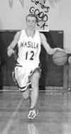 Buddy Bailey brings the ball down the court for Wasilla against
the Palmer Moose during the 2002-03 season. Bailey will now be
handling the ball for the California Baptist Lancers. Bailey sig