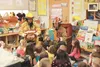Central Mat-Su firefighters Mark Easter and Jamie Rodriguez read books to students at Machetanz Elemetnary School. They also brought ice cream sandwiches to share and danced Gangnam style wit