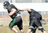 A Colony Knight varsity football player avoids a tackle during
practice Monday afternoon. The football season begins for the
Knights Saturday at 4 p.m. against the North Pole Patriots at
Colo