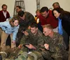 Col. Frank Donovan, commanding officer, 24th Marine Expeditionary Unit, show Dr. Kathleen Hicks, Deputy Under Secretary of Defense for strategy, plans, and forces a new communication system t