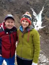 Wasilla Sunrise Rotary Club past president Dan Kennedy, left, and Lara Ruefenacht, a Rotary exchange student from Switzerland, pose in front of “Rotary Falls” near Government Peak last fall. 