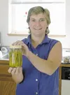 Valley resident Judy McKinley holds up a jar of her pickled
asparagus. What began as homemade gifts for friends and relatives
has grown into a small business, and McKinley now sells her jams
