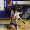 Palmer's Sarah LeCheminant tries to get out of the way as Carly Venzke goes after a loose ball during the second set of a 3-0 loss to Kodiak Oct. 31 at Palmer High School. LeCheminant recorde