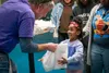 A little girl jumps for joy while receiving a bag to hold toys earned during the Month of the Military Child Carnival held on Joint Base Elmendorf-Richardson, Alaska on April 4. The Month of 