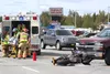 Medics load a patient into an ambulance Tuesday afternoon. The patient was driving a motorcycle down the Palmer-Wasilla Highway when he hit a pickup. Alaska State Troopers and a Mat-Su Boroug