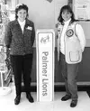Palmer Carrs-Safeway manager Terrie Clark-Newman, left, and Rita
McNeal of the Palmer Lions kick off the glasses drive by placing a
collection box in the foyer of the Palmer Carrs-Safeway. A 