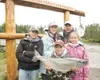(ROBERT DeBERRY/Frontiersman) Caleb Williams, 7, stands holding
his 11 pound Silver Salmon with his family from left, Ben, 12,
mother Tammy, father Joe and Krysten, 10, at the Little Su Publi