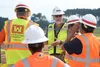 U.S. Army Engineering and Support Center, Huntsville employees receive a site briefing by a SunPower Corporation contractor before visiting a solar array construction site on Redstone Arsenal
