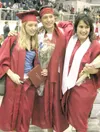 WILL ELLIOTT/Frontiersman Wasilla High graduates Jill Hanson,
Michael Maestas and Katie Montanelli hug after Wednesday’s
graduation ceremony. The three were among more than 270 students
who c