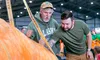 The 2025 Alaska State Fair pumpkin weigh-off champion Dale Marshall shares tips about his winner with second-place finisher Ron Passarella, of Palmer, Monday afternoon. J. David McChesney/Fro