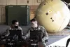Chief Warrant Officer 2 Nathan Paquette and Chief Warrant Officer 2 Carlos Gil, network management technicians, 4th Space Company, 1st Space Battalion, test a Ground Antenna Transmit and Rece