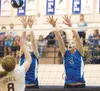 ROBERT DeBERRY/Frontiersman Members of the Palmer High varsity
volleyball team reach above the net for a block during the Palmer
Jamboree Friday ay Palmer High School.