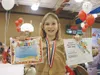 Kimberly Ingraham proudly displays awards she was presented on
Thursday at the first Iditarod Elementary Awards Ceremony. Courtesy
photo