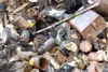 ROBERT DeBERRY/Frontiersman Everything from car parts to paint
cans and broken bottles littered a large area in the Sutton area
off Jonesville Road. More than a dozen volunteers came together