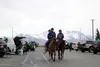 Allie Hrncir rode her horse Banjo with her mother Dorothy riding her horse Pearl as Colony Middle School families toured to the parking lot to interact with teachers Friday. Tim Rockey/Fronti