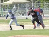 Houston first baseman Greg Schmidt runs down a Soldotna player.
ROBERT DeBERRY/Frontiersman